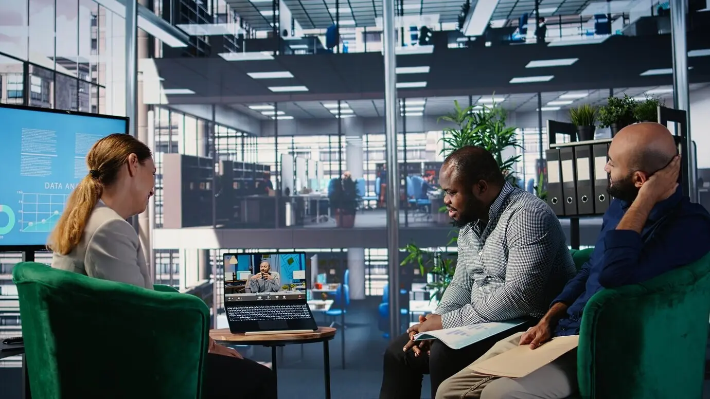 Remote briefing session between diverse business professionals in a strategic partnership